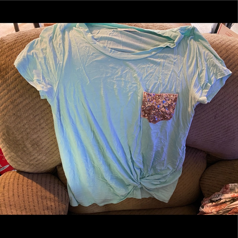 Light blue shirt with sequined pocket